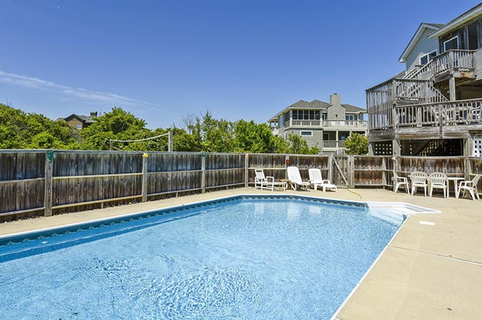 Large pool in the backyard of this semi-oceanfront Outer Banks Beach Rental Home on Whalehead Drive in Corolla, North Carolina.