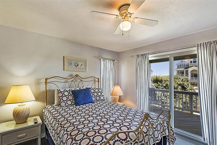 Beautiful bedroom of a semi-oceanfront Outer Banks Beach Rental Home in Corolla, North Carolina.